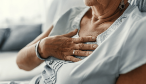 Nursing Home Abuse Lawyer Dayton, OH- elderly woman sitting with hand on chest