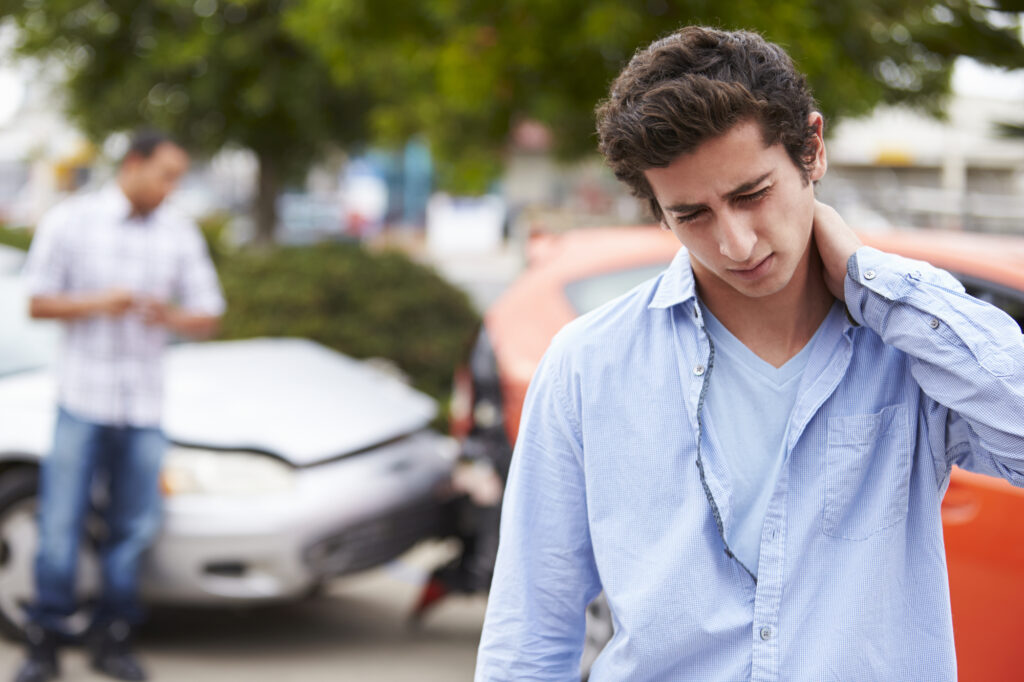 The Most Common Forms of Personal Injuries Cases - Teenage Driver Suffering Whiplash Injury Traffic Accident