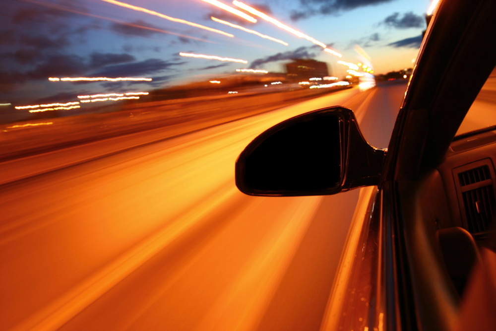Car drives down the highway after a meeting with a pedestrian accident lawyer
